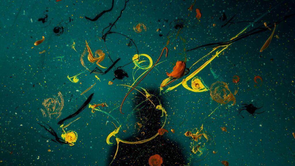 Abstract painting with a persons shadow over it